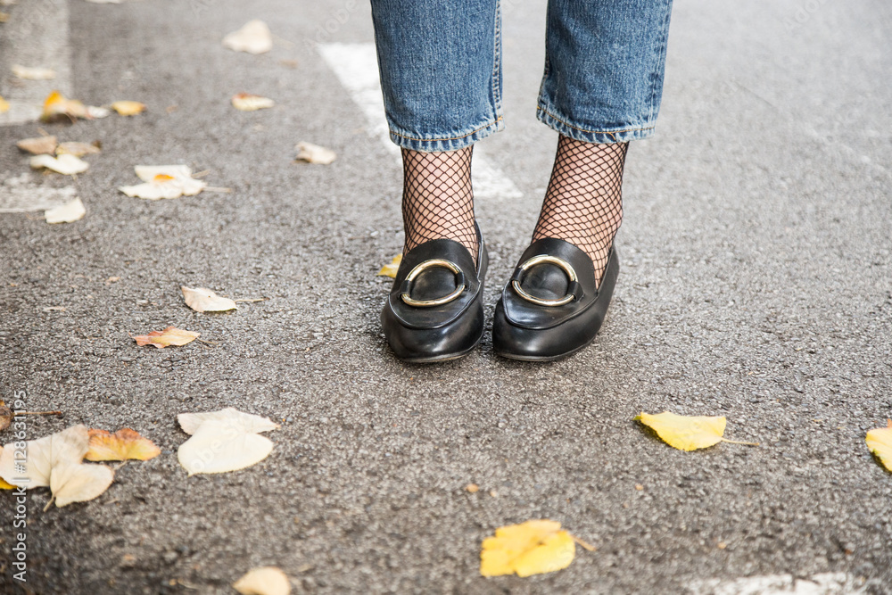 fall outfit fashion details. young stylish woman wearing black loafers

