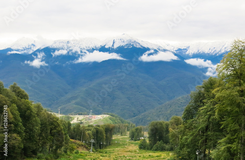 snow-capped peaks, the forest on a mountain slope