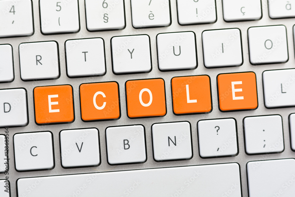 ECOLE writing on white keyboard ECOLE writing on white keyboard
