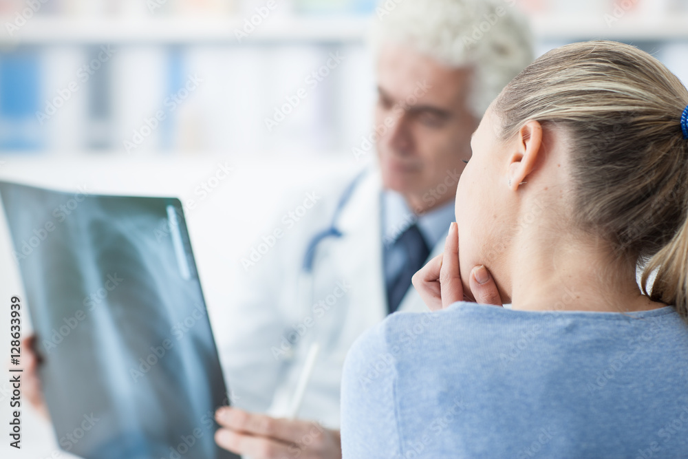 Doctor examining a patient's x-ray Doctor examining a patient's x-ray