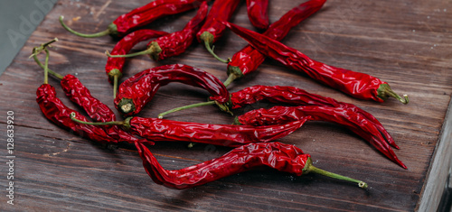 red dry chili pepper on wooden background 