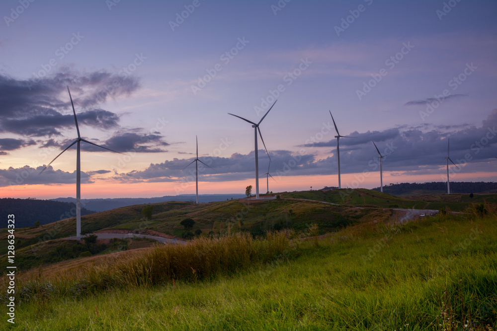 Obraz premium Wind turbine power generator at twilight