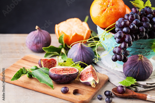 Summer Fruit Background with Grape, Orange and Figs. Healthy Foo