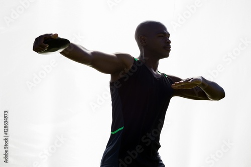 Bild auf Leinwand Athlete about to throw a discus