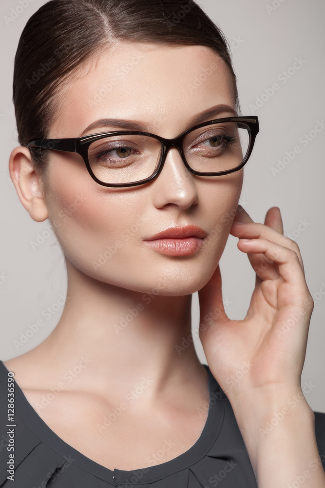 Close-up portrait of beautiful young woman in stylish glasses Close-up portrait of beautiful young woman in stylish glasses