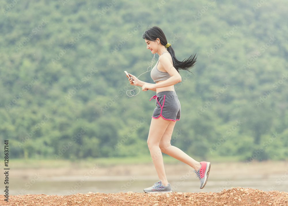 runner - woman running outdoors training for marathon run. Beautiful fit  and asian fitness. Stock Photo | Adobe Stock