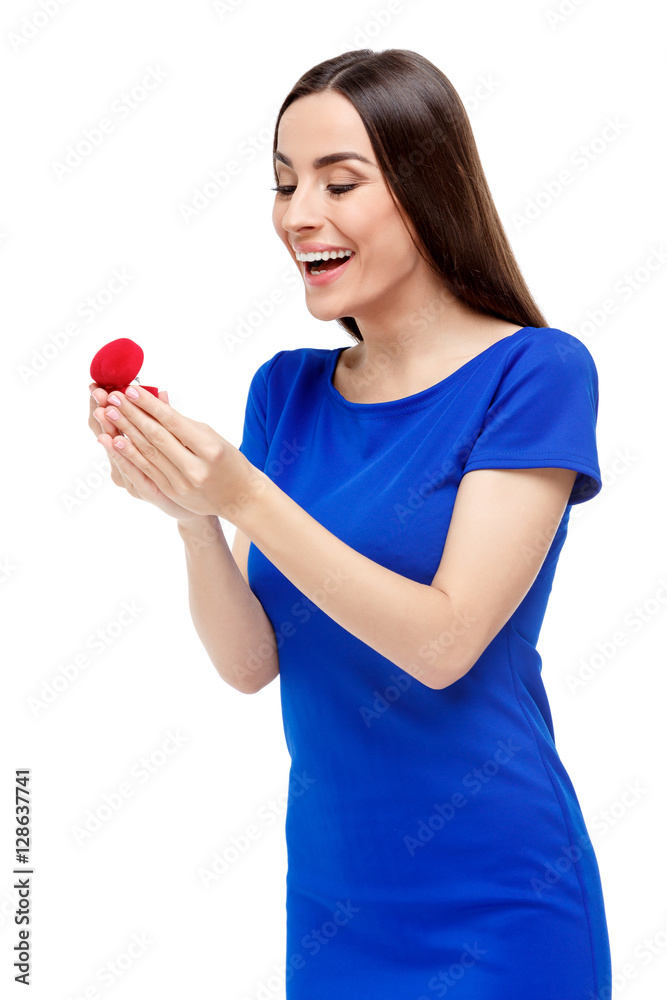 Beautiful woman holding heart shaped box with ring Beautiful woman holding heart shaped box with ring