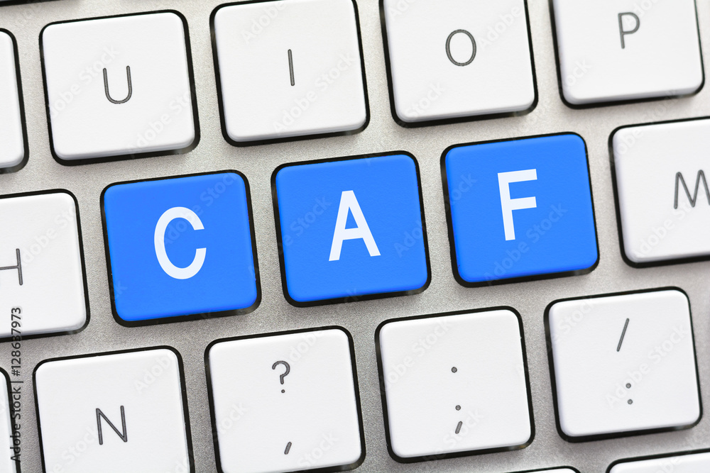 CAF writing on white keyboard CAF writing on white keyboard