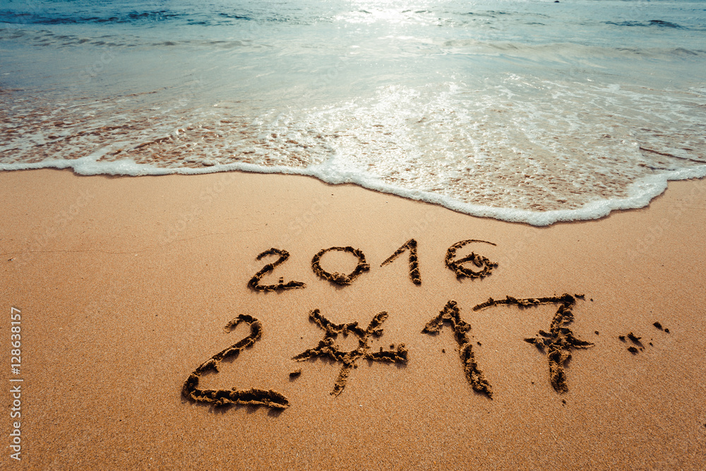 Happy New Year 2017, lettering on the beach Happy New Year 2017, lettering on the beach