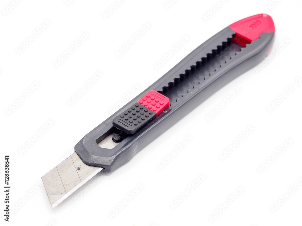 Black and red plastic cutter knife isolated Black and red plastic cutter knife isolated
