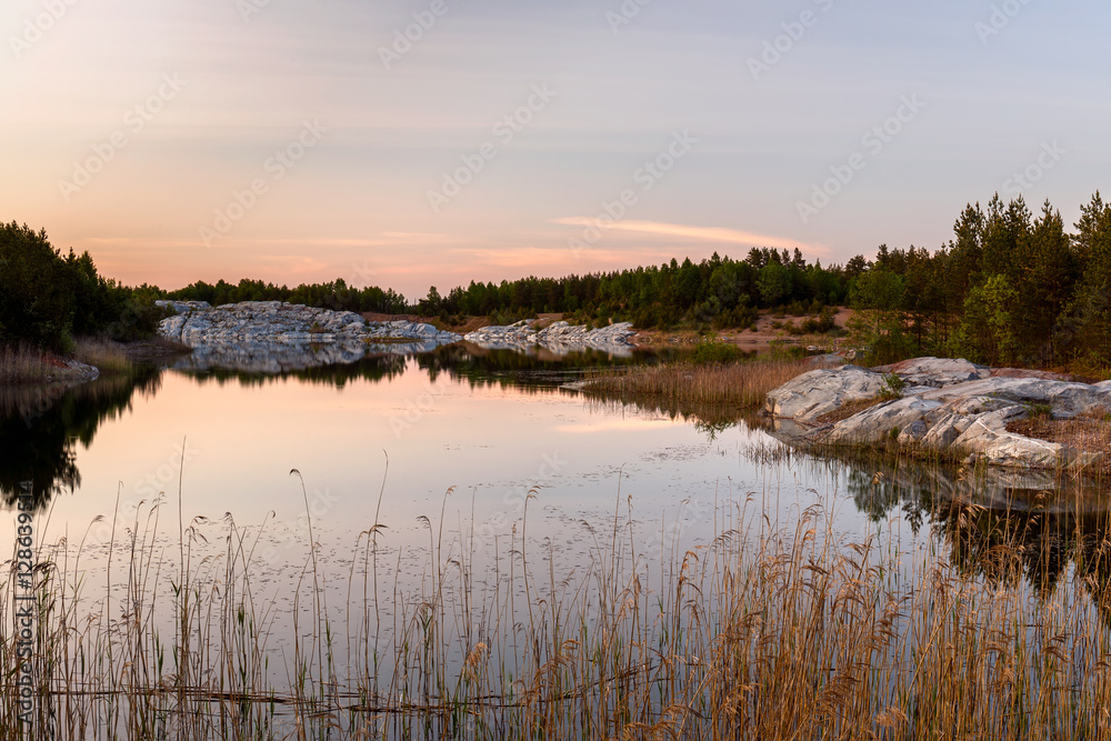 Pastel sunset over Swedish lake landscape