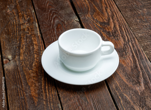 Fototapeta Naklejka Na Ścianę i Meble -  Empty coffe cup on dark table