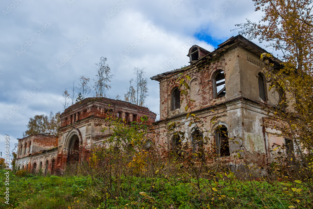 A derelict outbuilding to a dilapidated Church. The Village Of Rybinsk-Zaruch'ye.