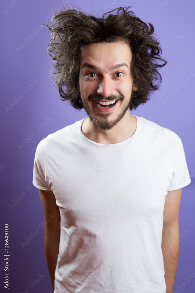 Beautiful caucasian man with funny hair over color background Beautiful caucasian man with funny hair over color background