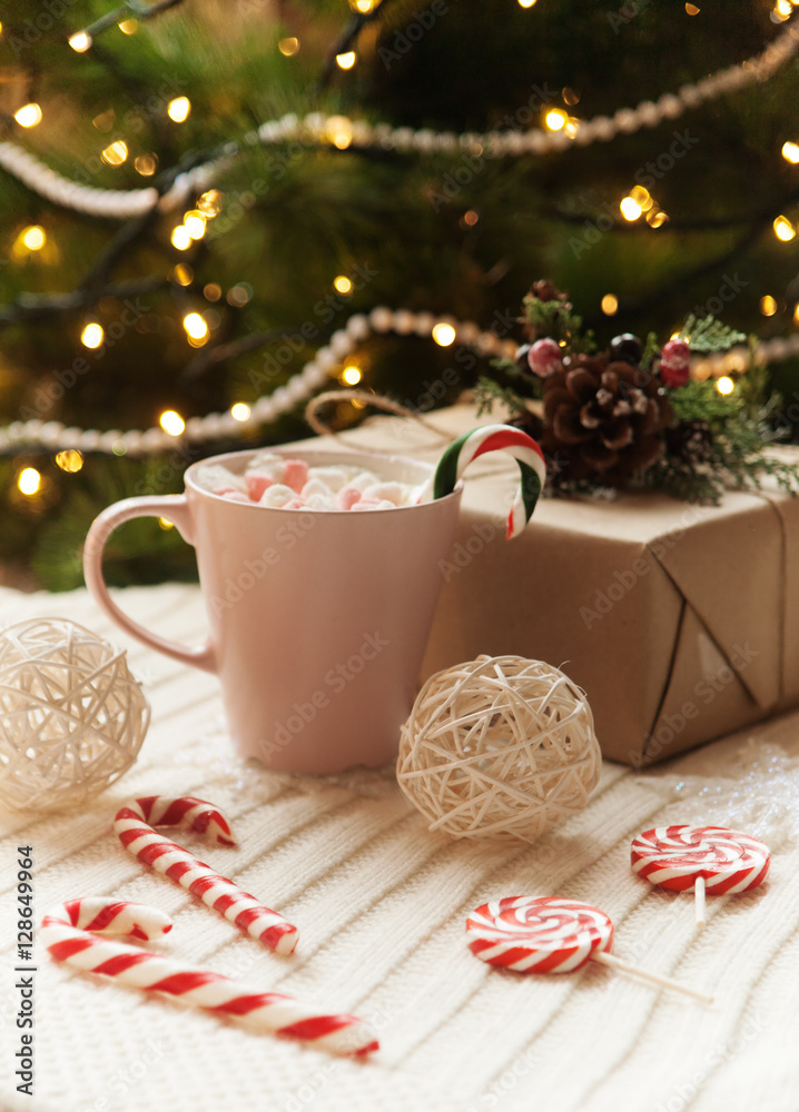 big mug of hot cocoa and sweet christmas candy