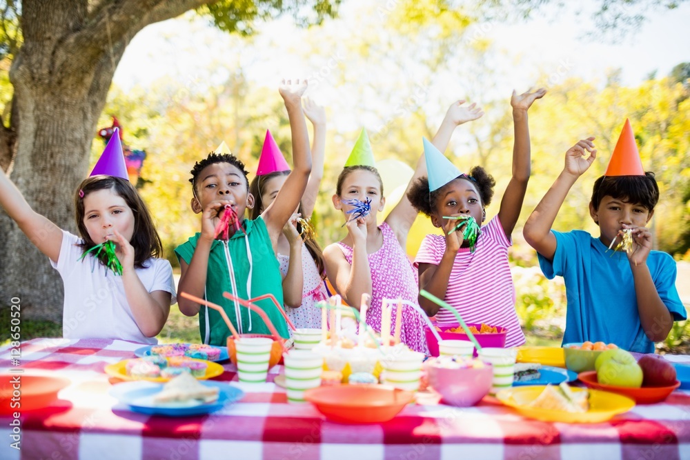 Cute mixed race children having fun during a birthday party Cute mixed race children having fun during a birthday party