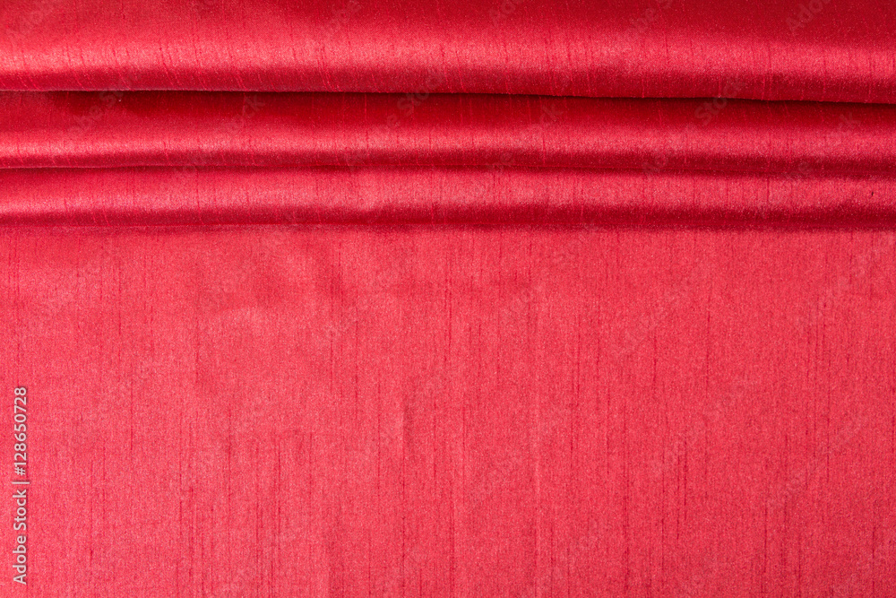 Fototapeta premium Rich red wavy fabric texture / background.