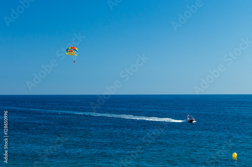 Tourists parasailing on Costa Dourada Beach in Salou, Spain