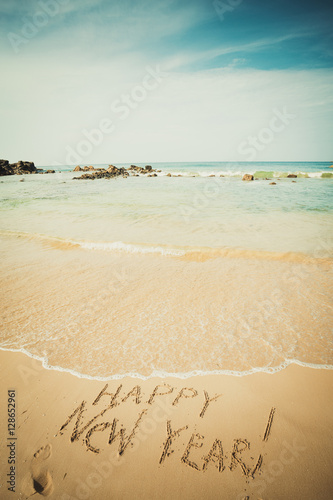 Wallpaper Mural New Year text on the sea beach. Torontodigital.ca