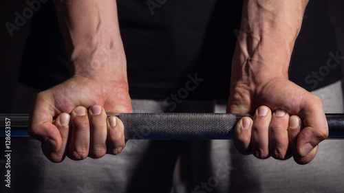 Man Lifting Heavy Barbell