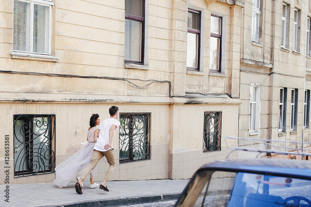 beautiful and young boy and girl walking down the street