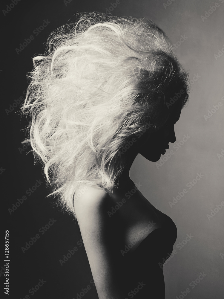 Beautiful blonde woman with volume hairstyle - obrazy, fototapety, plakaty 