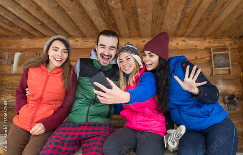 People Group Taking Selfie Photo Smart Phone Wooden Country House Terrace Winter Mountain Resort Friends On Vacation