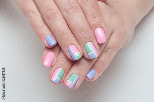 Рink, mint, lilac manicure with white stripes on the square nails