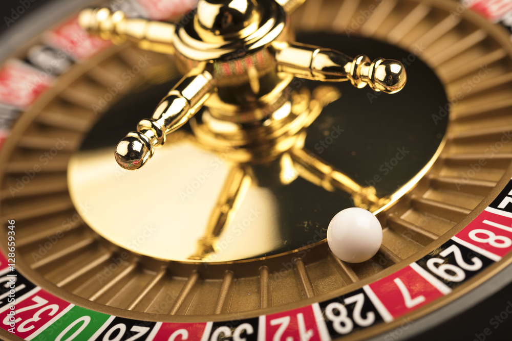 Casino theme. Golden roulette wheel closeup. Casino theme. Golden roulette wheel closeup.