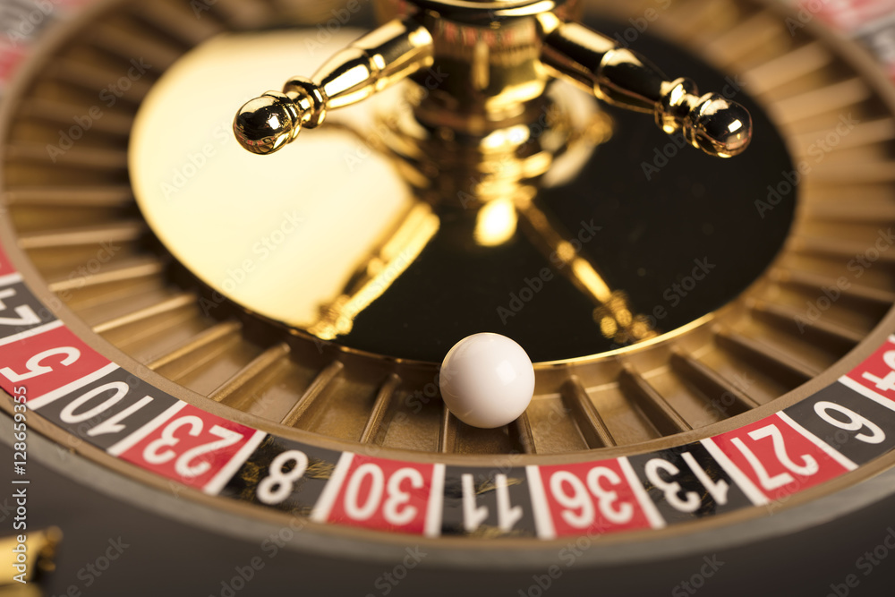 Casino theme. Golden roulette wheel closeup. Casino theme. Golden roulette wheel closeup.