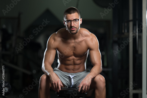 Nerd Man After Exercise Resting In Gym