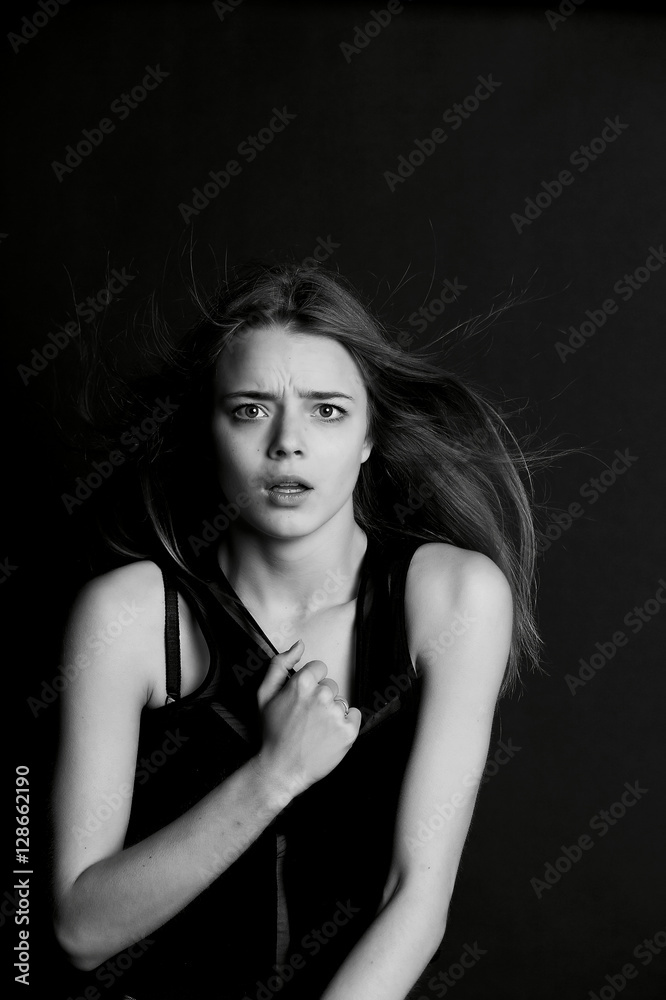 Naklejka premium Young beautiful girl builds faces. Hamming , fun