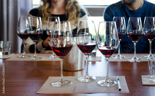 Photography Wine tasting experience in Langhe (Italy) with three glasses of Nebbiolo on a ta