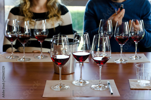 Canvas Print Wine tasting experience in Langhe (Italy) with three glasses of Nebbiolo on a ta