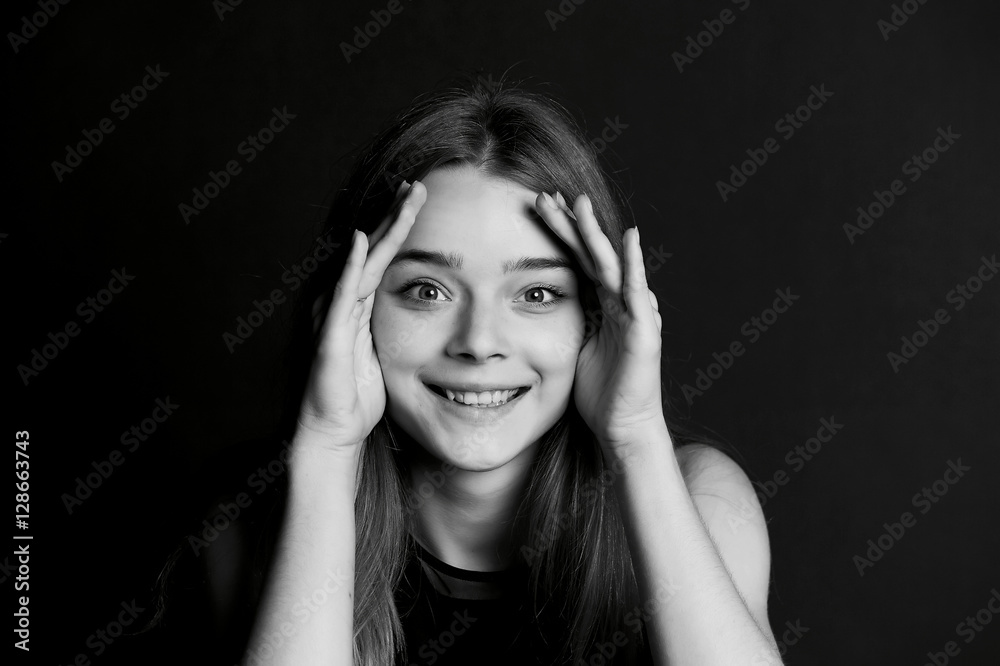 Fototapeta premium Young beautiful girl makes magical passes with his hands. BW
