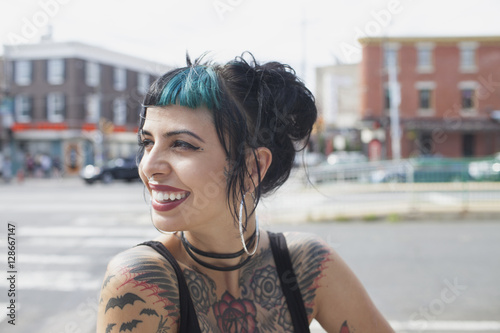 A portrait of a young woman with black and blue hair. photo