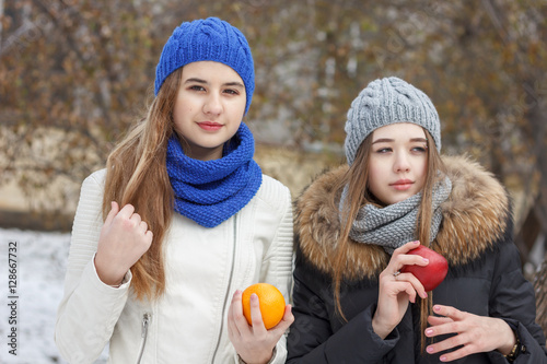 Beautiful girl on the nature in the winter outside in winter hat