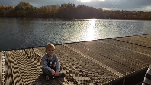 Child smiling on jetty