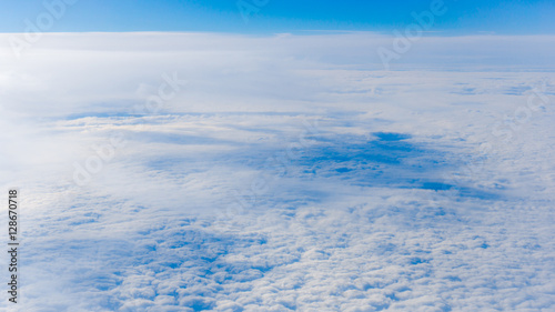  clouds from airplane window. height of 10 000 km.  Clouds © EwaStudio
