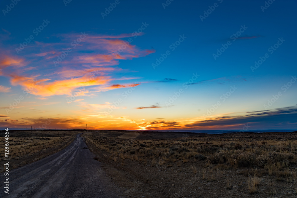 Sunset over a rural dirt road