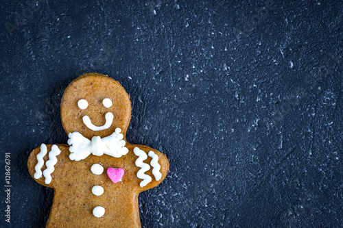 Christmas gingerbread on dark background top view