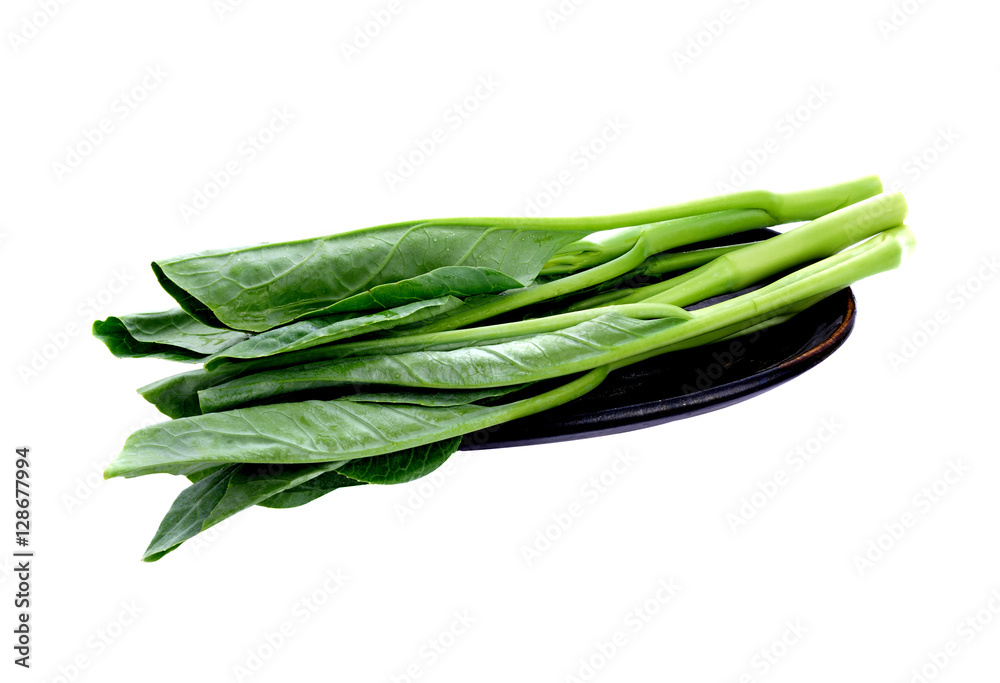 Chinese kale vegetable in brown plate on white background Chinese kale vegetable in brown plate on white background