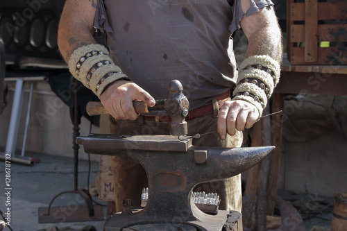 Fototapeta Naklejka Na Ścianę i Meble -  hands of blacksmith