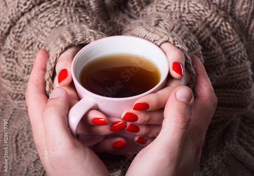 Tea in woman hand