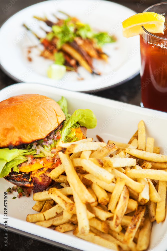 tri-tip sandwich with with fries and a side of grilled carrots and an ice tea, Wildwood Kitchen, Santa Barbara, California tri-tip sandwich with with fries and a side of grilled carrots and an ice tea, Wildwood Kitchen, Santa Barbara, California