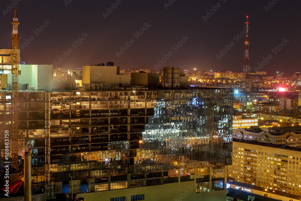 Night view from the roof on Construction of a modern building. Voronezh