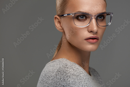 Female Eyewear. Woman In Beautiful Glasses Frame, Eyeglasses photo