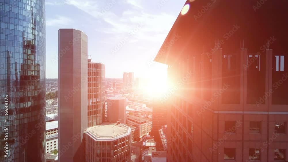 aerial view of city skyline at sunset.