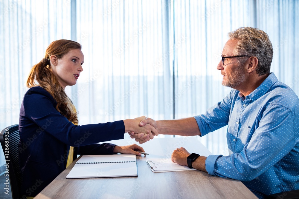 Two businessmen giving a handshake Two businessmen giving a handshake