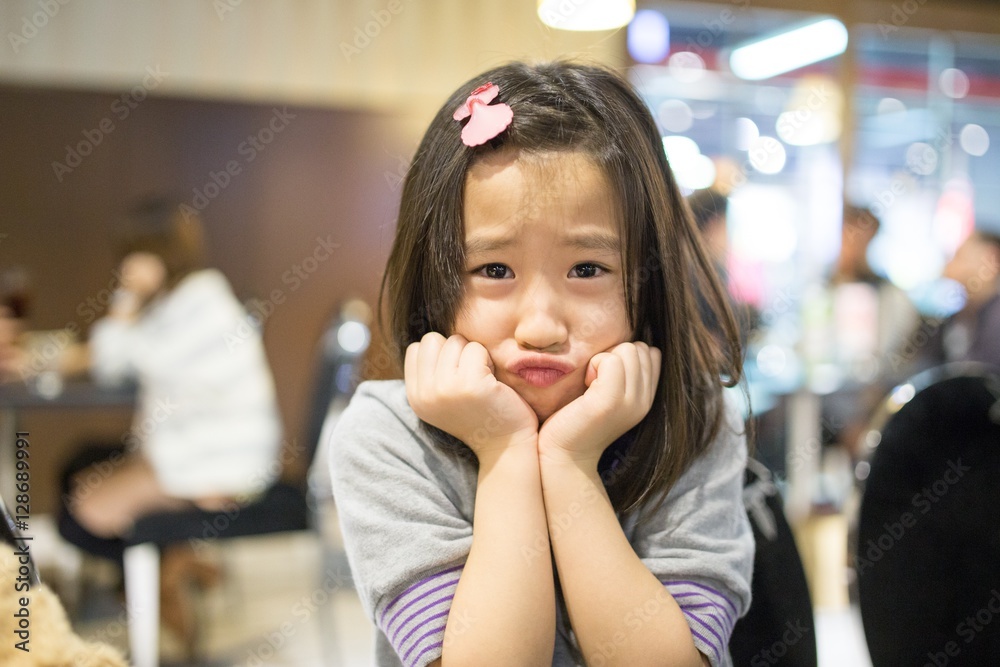 The girl makes a cute face in front of the camera. The girl makes a cute face in front of the camera.